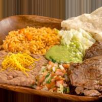 9. Carne Asada Plate · Grilled steak topped with pico de gallo, guacamole, and lettuce. Comes with 1 flour tortilla.
