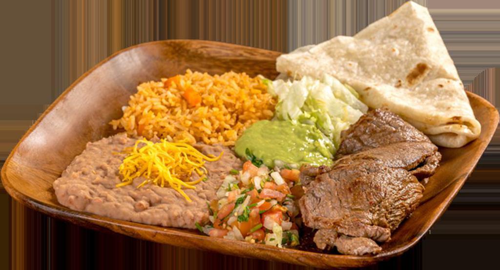 9. Carne Asada Plate · Grilled steak topped with pico de gallo, guacamole, and lettuce. Comes with 1 flour tortilla.