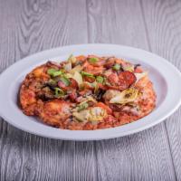 Wombo Combo Pizza · Primo pepperoni, Italian sausage, linguica, bacon, mushrooms, tomatoes, artichoke hearts, gr...