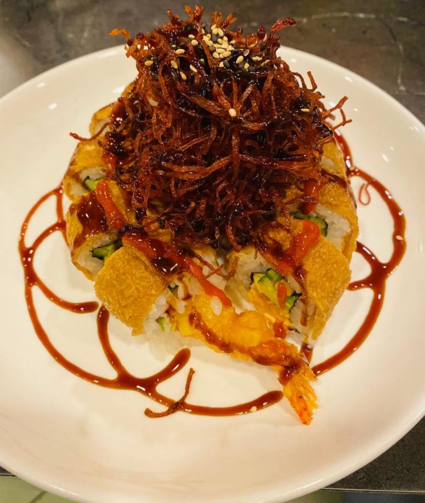 Medusa Sumo Special · Spicy crab, avocado, cucumber, and shrimp tempura topped with inari, and deep-fried crab stick. Spicy.