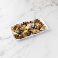 Brussel Sprouts · Garlic, applewood smoked bacon and shaved Parmigiano cheese.