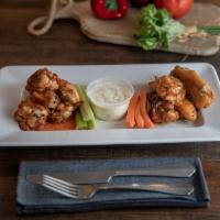 Oven Roasted Wings · Double-baked for a crispy and flavorful wing without the use of a fryer or added oils. Hand-...