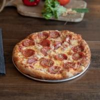 Pepperoni Pizza · Mellow red sauce, mozzarella, and pepperoni on Mellow's crust, buttered and sprinkled with P...