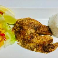 Seared Cajun Tilapia · Served with jasmine rice and vegetables.