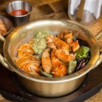 Bul Dak Bulbap · Spicy chicken marinated in our Buldak sauce served with jalapeno sauteed onions with guacamo...