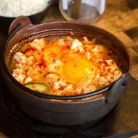 Soon Do Boo Soup · Traditional spicy soft tofu (Comes with egg) Served with bowl of white rice and side of kimc...