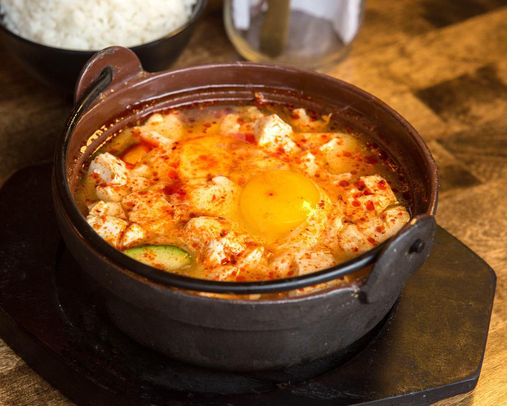 Soon Do Boo Soup · Traditional spicy soft tofu (Comes with egg) Served with bowl of white rice and side of kimchi.