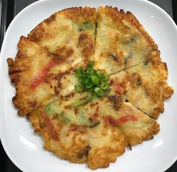 Pajeon · Crispy Korean pancake.  Choice of Kimchi, Scallion or Seafood.