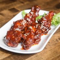 Yang Yum Chicken · Popular Korean spicy flavor from go chu jang and garlic based sauce. Korean style fried chic...