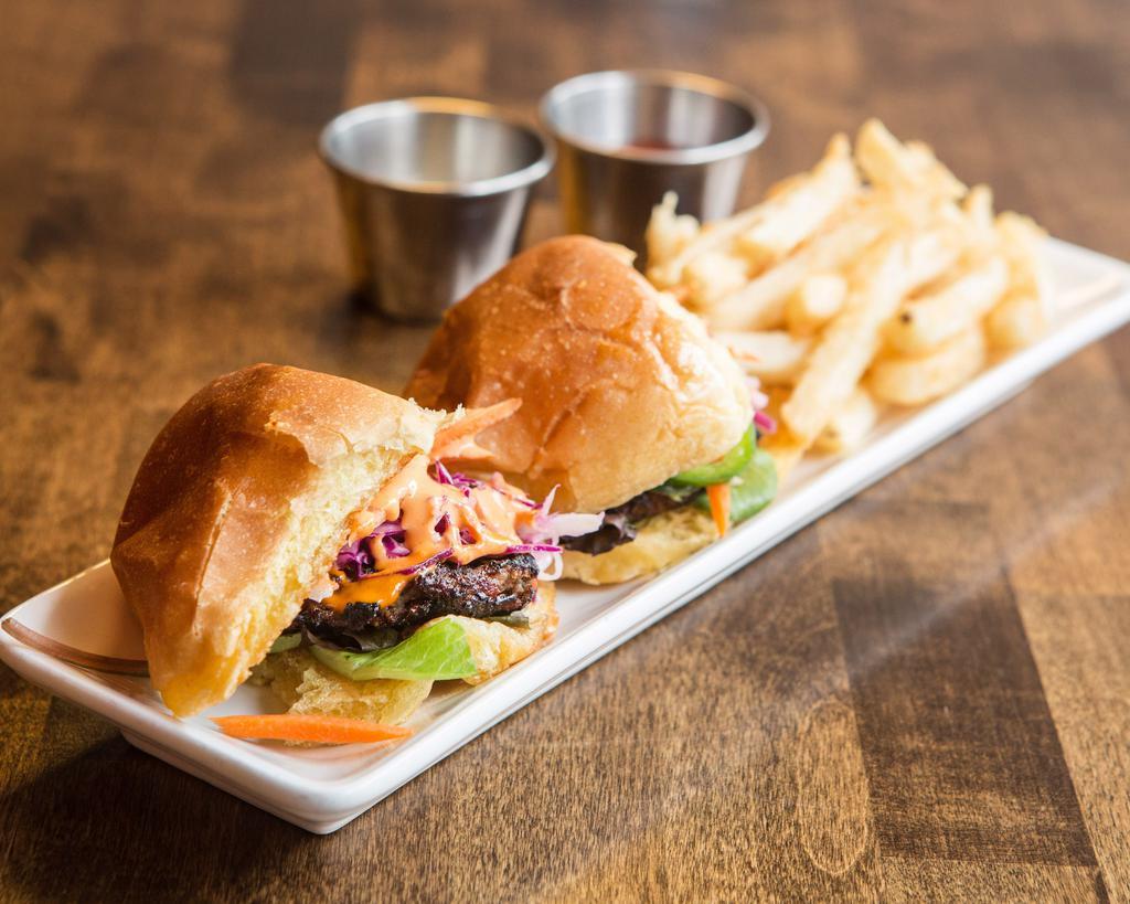 Galbi Sliders · Premium short rib beef marinated in traditional galbi sauce with french fries. 2 per serving.