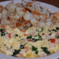 Canadian Scrambler · Scrambled eggs, Canadian bacon, spinach, diced tomatoes. 