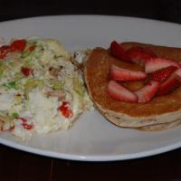 Sandra Scrambler  · Egg whites scrambled with chicken, roasted red peppers and avocado, includes multi-grain pan...