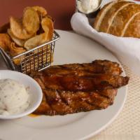 Dry Rubbed Tri Tip · 10 oz. of choice smoked Angus tri tip glazed and. Served with 2 sides and sourdough bread wi...