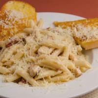 Chicken Penne Pasta · Penne pasta noodles tossed in a skillet with grilled chicken breast, sun-dried tomatoes, fre...