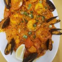 Persian Style Paella Special · Shrimp, scallops, mussels, clams, fish, calamari, chicken and vegetables with a garlic curry...