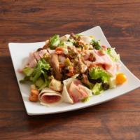 Antipasto Salad · Garden salad topped with ham, salami, shredded mozzarella, and pepperoncini.