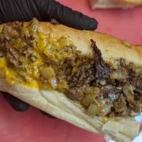 Classic Philly Cheesesteak · Chopped steak, fried onions, cheese whiz.