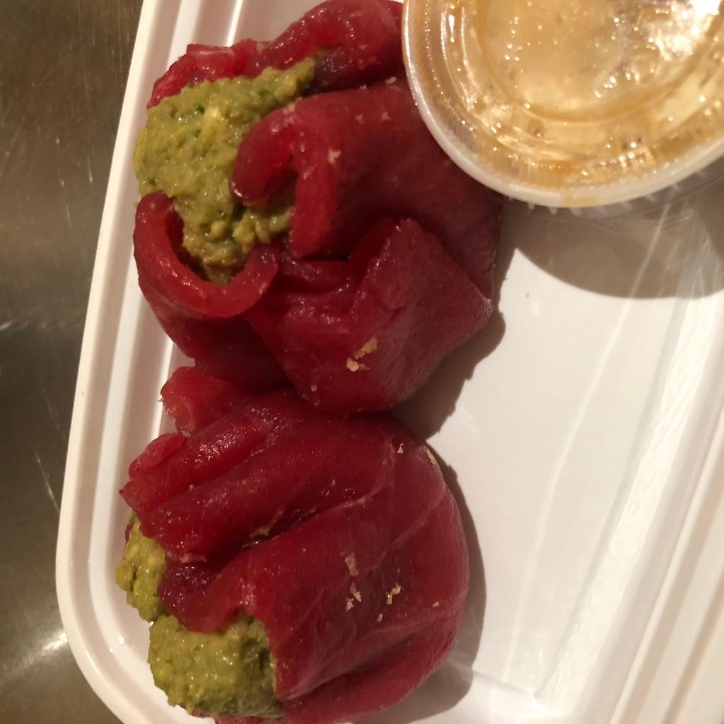 Tuna Dumplings · Avocado, wasabi caviar, scallion wrapped with tuna. Served with scallion truffle oil and wasabi vinaigrette sauce.