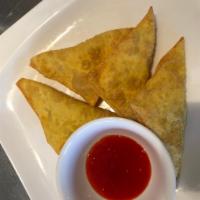Crab Ragoon · 6 pieces fried cheese wontons with sweet passionfruit sauce 