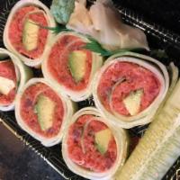 Naruto Roll · Your choice of seafood and avocado wrapped with cucumber.