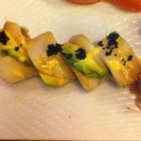 Queen's Roll · Lobster, shrimp tempura and spicy tuna topped with white tuna, avocado and caviar. Served wi...