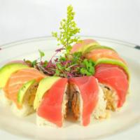King's Roll · King crab, lobster and cucumber. Wrapped with tuna, salmon and avocado. Served with spicy ma...
