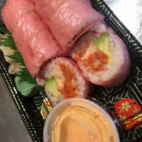 Sexy Girl Roll · Lobster, spicy tuna, king crab, and avocado wrapped with soybean sheet. Served with spicy ma...