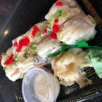 Scallop California Roll · Spicy crab meat, avocado and crunch inside topped with seared scallop, tobiko and chef's spe...