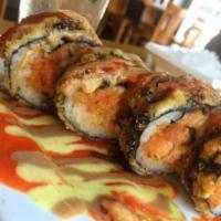 Super Spicy Tuna Roll · Blue crab, spicy tuna, lobster, avocado and cream cheese wrapped with crispy panko. Served w...