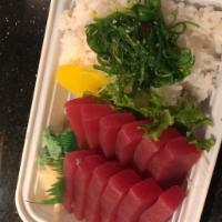 Tekka Don · 12 pieces of tuna sashimi on a bed of sushi rice. Served with miso soup or salad.