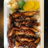 Unagi Don · Eight pieces toasted eel on a bed of rice. Served with miso soup or salad.
