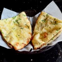 Garlic Naan · Clay oven baked bread stuffed with fresh garlic and green coriander.