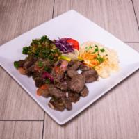 Makanek Plate · Homemade, Lebanese style beef sausage, sauteed with onions and tomatoes, drowned with lemon ...