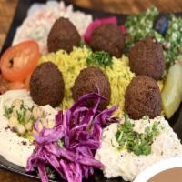 Jerusalem Vegetarian Sampler · Falafel, hummus, baba ghanough, and mix salad.