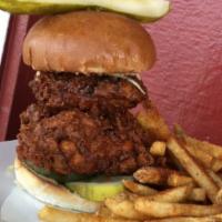 Nashville Chicken Sandwich · fried chicken breast, nashville hot oil, pickles, citrus slaw, house sauce on a bun