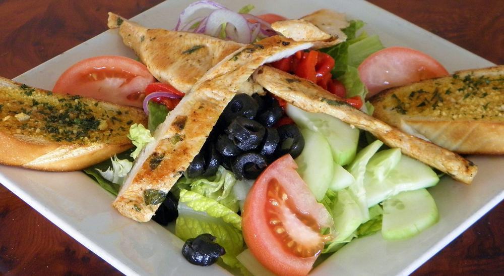 Grilled Chicken Salad · Served with your choice of dressing. 

