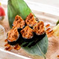 Dynamite Maki · Raw spicy salmon and masago avocado topped with mixed masago, real crab meat, spicy mayo and...
