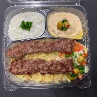 Kabab Plate With Pita Bread صـحن كبــاب · Beef, rice, pita, onion, tomato, hummus, Tzatziki, lettuce and choice of sauce.