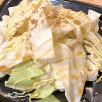 Umadare Cabbage · Crisp cabbage tipped with Japanese soup stock and sesame oil.