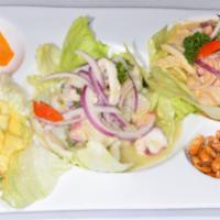 Tri Color Mixto Ceviche · Ceviche mixto tres colores. Served in 3 flavors. Our traditional lemon and lime, aji amarill...