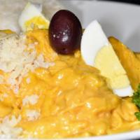 Aji de Gallina · Shredded chicken in a yellow Peruvian chile cheese sauce. Mildly spicy and very delicious. A...