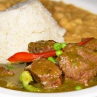 Cilantro Beef Stew · Seco de res en salsa de cilantro. Served with white rice and white beans. Con arroz blanco y...