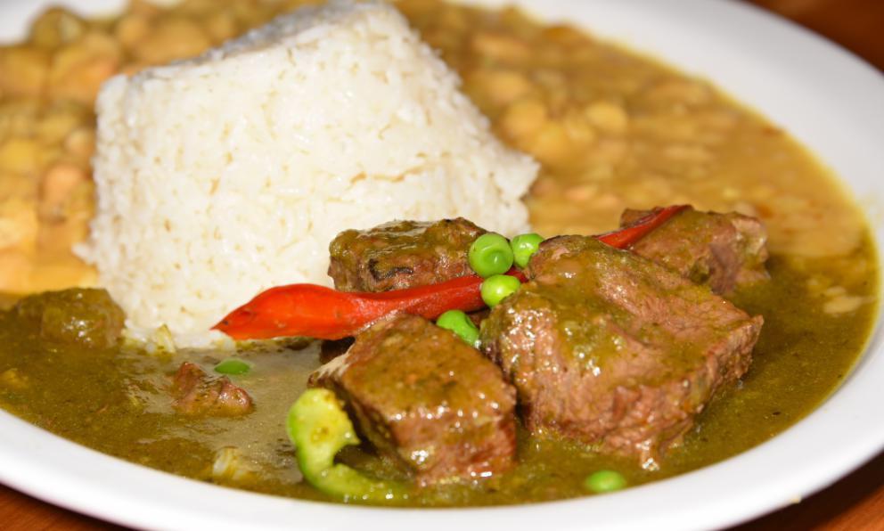 Cilantro Beef Stew · Seco de res en salsa de cilantro. Served with white rice and white beans. Con arroz blanco y frijoles blanco.