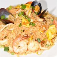Seafood Fried Rice / Arroz chaufa de mariscos · Our amazing fried rice with calamari, shrimp, and octopus.