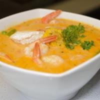 Chupe de Camarones · Peruvian shrimp chowder includes shrimp, rice, vegetables, with a poached egg. A peruvian na...