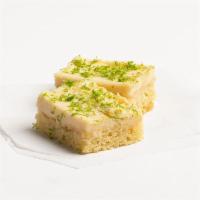key lime cake  · tangy lime cake topped with a layer of  key lime cheesecake and lime zest.