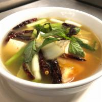 S18. Vegetables Tom Yum Soup · Hot and sour soup with combination vegetables , lemongrass, onion, cilantro, tomato and mush...