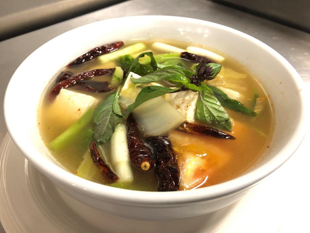 S18. Vegetables Tom Yum Soup · Hot and sour soup with combination vegetables , lemongrass, onion, cilantro, tomato and mushroom.
