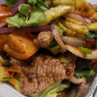 I28. Beef Salad · Thai herbs seasoning, tomato, red onion, shredded carrot, and cucumber.