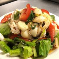 I33. Spicy Seafood Salad · Combination seafood seasoned with spicy lime dressing.